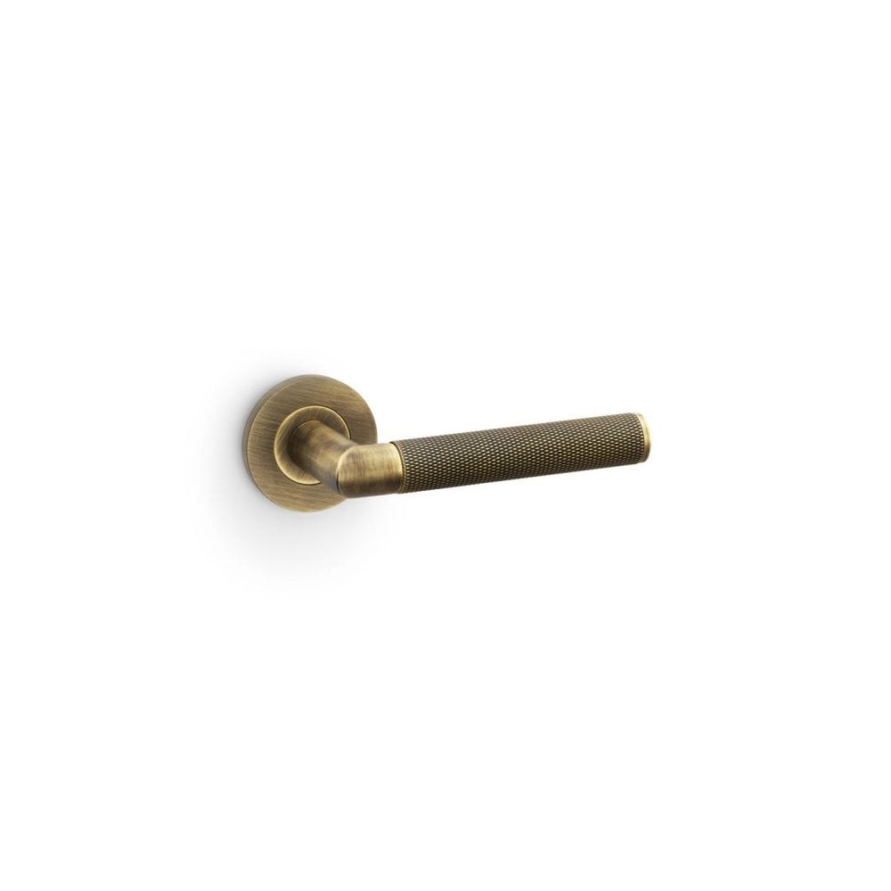 Carlisle Brass Antique Brass Harrier Knurled Lever on Round Rose Handle Pair AW210-grp