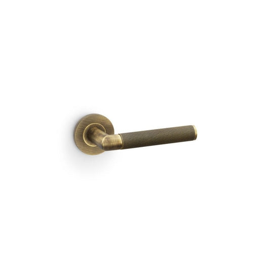 Carlisle Brass Antique Brass Harrier Knurled Lever on Round Rose Handle Pair AW210-grp