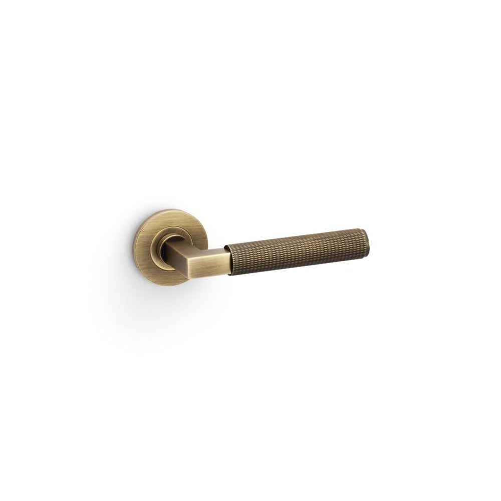 Carlisle Brass Antique Brass Hurricane Knurled Lever on Round Rose Handle Pair AW200AB