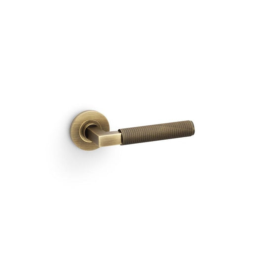 Carlisle Brass Antique Brass Hurricane Knurled Lever on Round Rose Handle Pair AW200AB